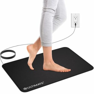 Person walking on a grounding mat connected to a power outlet.